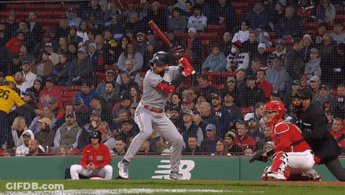 A Baseball Player With The Number 26 On His Jersey Swings His Bat GIF