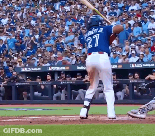 A Baseball Player With The Number 27 On His Jersey Is Swinging His Bat GIF
