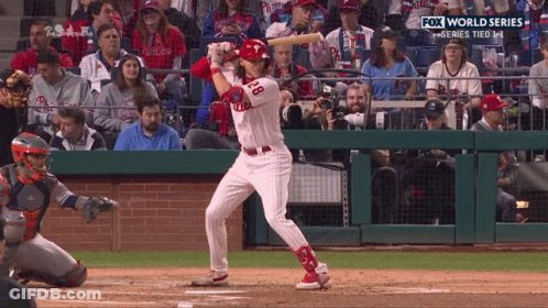 A Baseball Player With The Number 28 On His Jersey Swings At A Pitch GIF