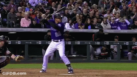 A Baseball Player With The Number 28 On His Jersey Swings His Bat GIF
