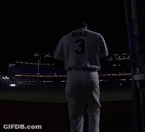 A Baseball Player With The Number 3 On His Jersey Is Running On A Field At Night GIF