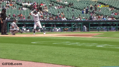 A Baseball Player With The Number 33 On His Jersey Swings At A Pitch GIF
