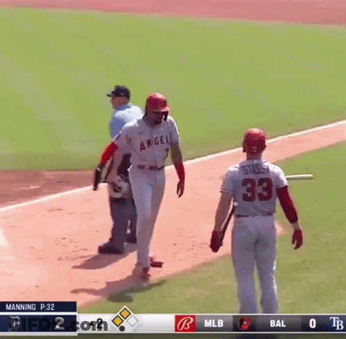 A Baseball Player With The Number 33 On The Back Of His Jersey Stands On The Field GIF