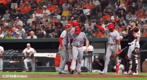 A Baseball Player With The Number 35 On His Jersey Is Being Helped By His Teammates GIF