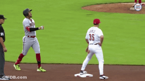A Baseball Player With The Number 35 On His Jersey Stands On The Base GIF