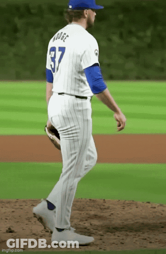 A Baseball Player With The Number 37 On His Back Is Walking On The Field GIF