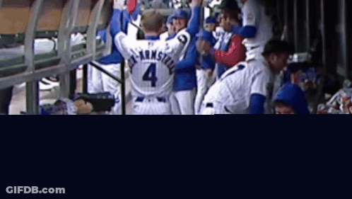 A Baseball Player With The Number 4 On His Back Stands In A Dugout GIF