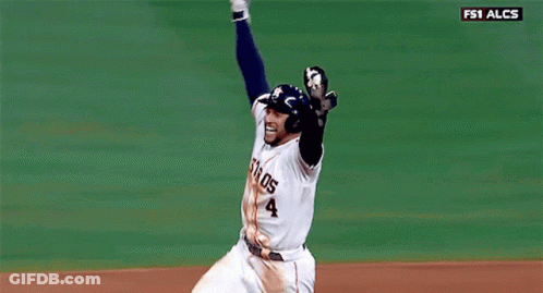 A Baseball Player With The Number 4 On His Jersey Is Celebrating GIF