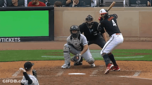 A Baseball Player With The Number 4 On His Jersey Is Swinging At A Pitch GIF