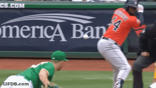 A Baseball Player With The Number 4 On His Jersey Swings At A Ball GIF