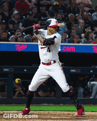 A Baseball Player With The Number 4 On His Jersey Swings His Bat GIF