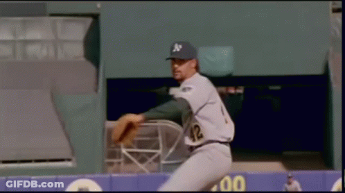 A Baseball Player With The Number 42 On His Jersey Is About To Throw The Ball GIF