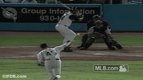 A Baseball Player With The Number 45 On The Back Of His Jersey Swings At A Pitch GIF