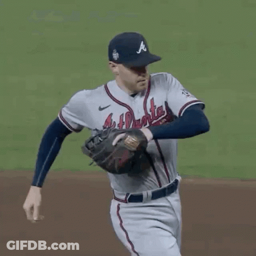 A Baseball Player With The Number 5 On His Back Is Trying To Steal A Base GIF