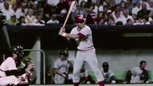 A Baseball Player With The Number 5 On His Jersey Is Swinging At A Ball GIF