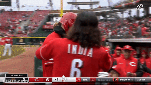 A Baseball Player With The Number 6 On His Back Is Hugging Another Player GIF