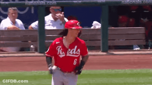 A Baseball Player With The Number 6 On His Jersey Is Walking On The Field . GIF