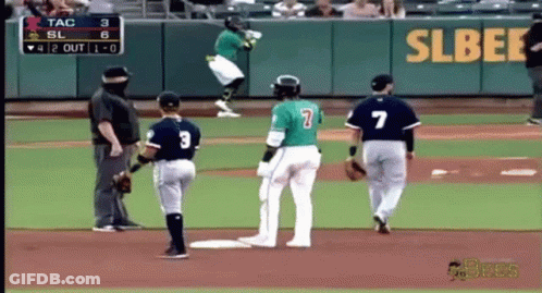 A Baseball Player With The Number 7 On His Back Is Jumping In The Air GIF