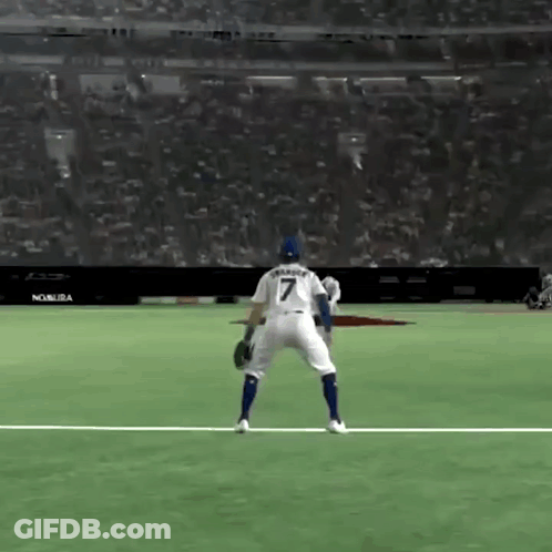 A Baseball Player With The Number 7 On His Back Is Standing On The Field . GIF