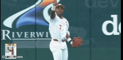 A Baseball Player With The Number 7 On His Jersey Stands In Front Of A Riverview Sign GIF