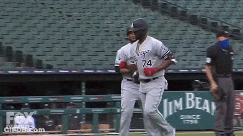 A Baseball Player With The Number 74 On His Jersey Runs Towards The Dugout GIF