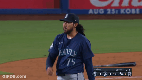 A Baseball Player With The Number 75 On His Jersey Stands On The Field GIF