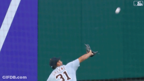 A Baseball Player With The Number 8 On His Jersey Is Laying On The Ground GIF