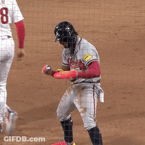 A Baseball Player With The Number 8 On His Jersey Stands On The Field GIF