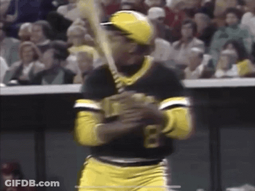 A Baseball Player With The Number 8 On His Shirt Is Swinging A Bat GIF