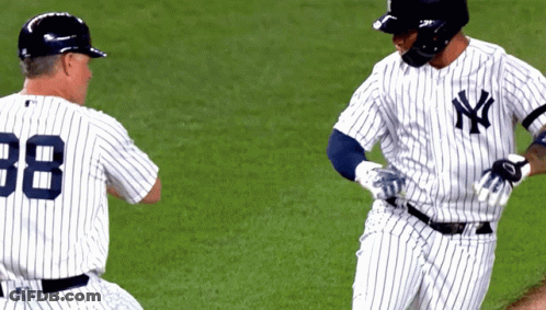 A Baseball Player With The Number 88 On His Back Is Standing Next To Another Player GIF