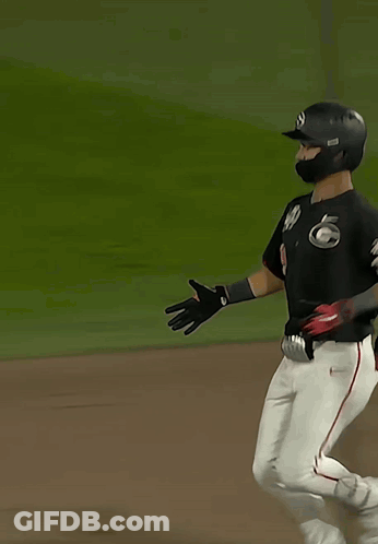 A Baseball Player With The Number 9 On His Back Is Running GIF