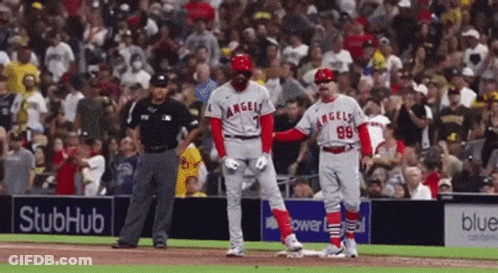 A Baseball Player With The Number 98 On His Jersey Stands On The Base GIF