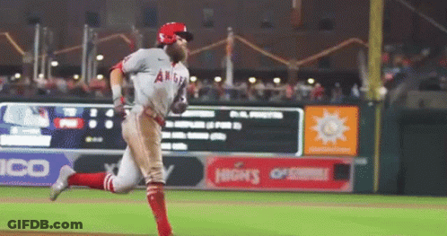 A Baseball Player With The Word Angels On His Shirt GIF