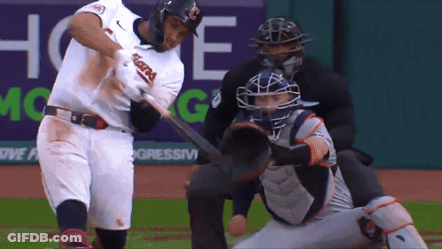 A Baseball Player With The Word Indians On His Jersey Swings His Bat GIF
