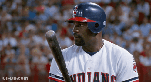 A Baseball Player With The Word Indians On His Shirt GIF