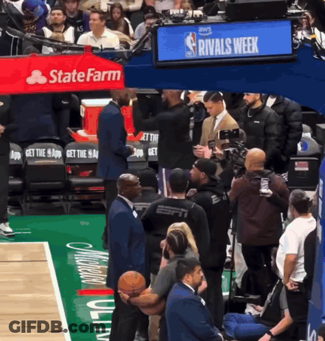 A Basketball Court With A Sign That Says Rivals Week In The Background GIF
