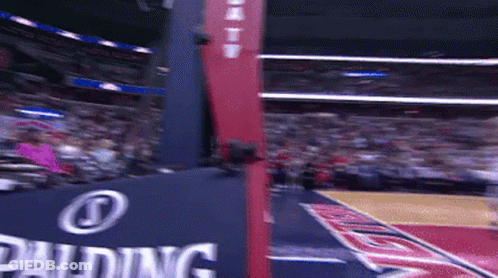 A Basketball Court With A Spalding Sign On It GIF