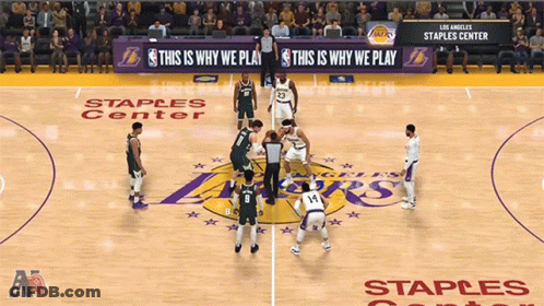 A Basketball Game Being Played At Staples Center GIF