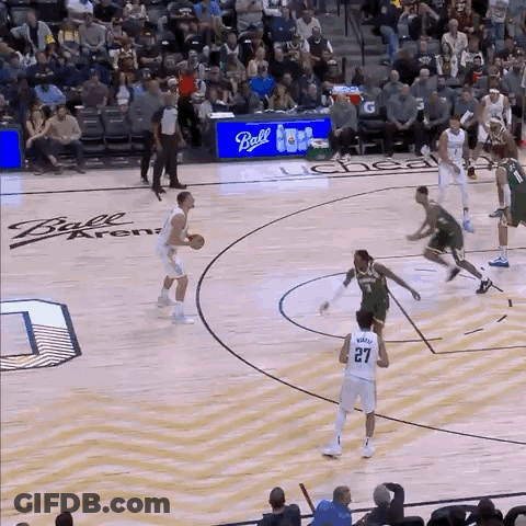 A Basketball Game Being Played At The Ball Arena GIF