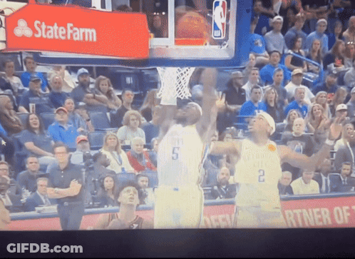 A Basketball Game Being Played In Front Of A State Farm Sign GIF