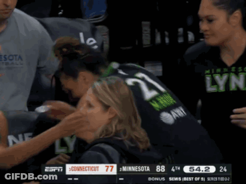 A Basketball Game Between Minnesota And Connecticut Is Going On GIF