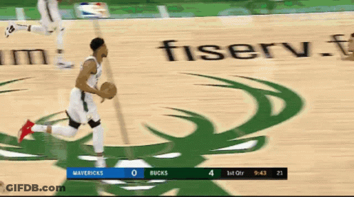 A Basketball Game Between The Mavericks And The Bucks Is Being Played GIF
