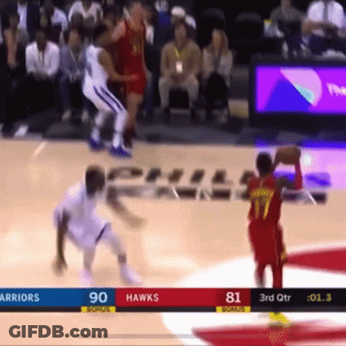 A Basketball Game Between The Warriors And The Hawks Is Being Played GIF
