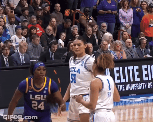 A Basketball Game Between Ucla And Lsu Is Being Played In Front Of A Crowd GIF