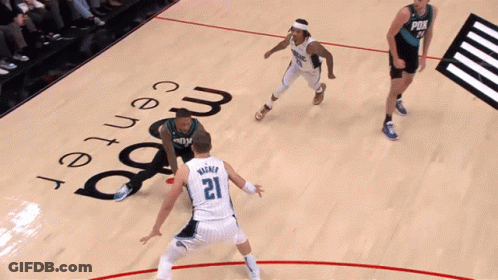 A Basketball Game Is Being Played At The Magic Center GIF