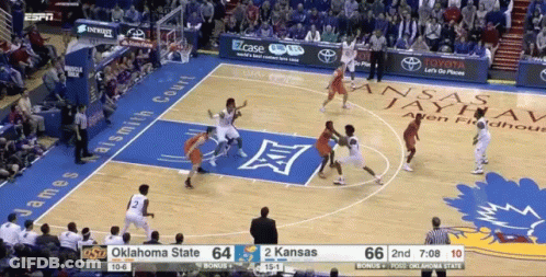 A Basketball Game Is Being Played Between Oklahoma State And Kansas State GIF