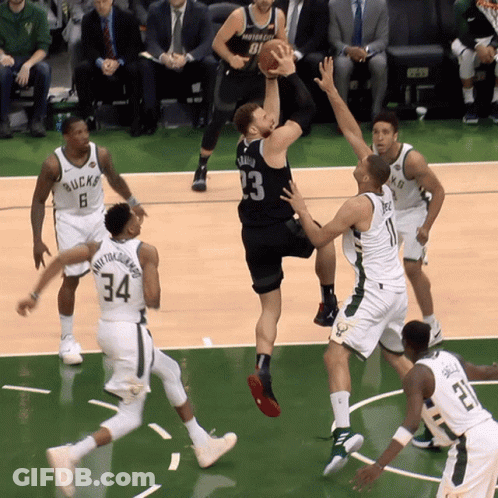 A Basketball Game Is Being Played Between The Bucks And The Wizards GIF