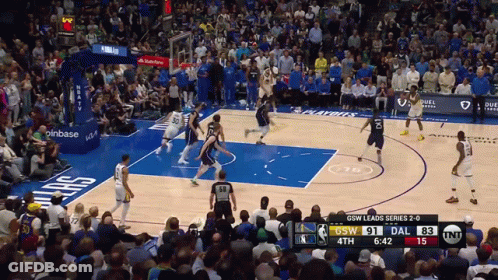 A Basketball Game Is Being Played Between The Dallas Mavericks And The Denver Nuggets GIF