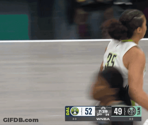 A Basketball Game Is Being Played Between The Dallas Mavericks And The New York Islanders GIF