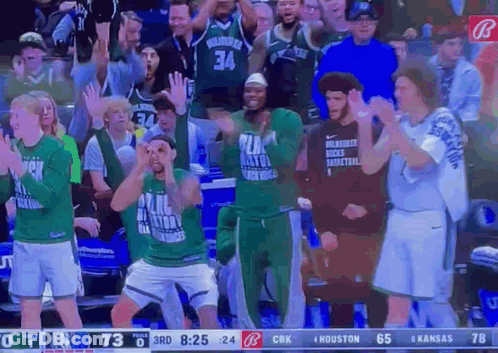 A Basketball Game Is Being Played Between The Milwaukee Bucks And Houston Rockets GIF